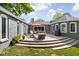 Inviting outdoor patio with a cozy fire pit, comfortable seating, and beautiful landscaping for entertaining at 6980 N Pennsylvania St, Indianapolis, IN 46220