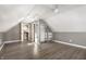 Bright attic with hardwood floors and multiple closets with storage providing ample space for storage and organization at 712 N Pendleton Ave, Pendleton, IN 46064