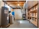 Unfinished basement showcasing essential utilities, ample storage space, and potential for future expansion or customization at 712 N Pendleton Ave, Pendleton, IN 46064