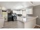 Functional kitchen featuring white cabinetry, stainless steel appliances, and bright lighting at 712 N Pendleton Ave, Pendleton, IN 46064