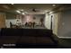 Finished basement featuring gray walls, dark carpeting, a ceiling fan, and versatile open layout at 720 Erin Dr, Avon, IN 46123