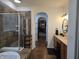 Bathroom with a glass enclosed shower, tile accents, and vanity with sink providing a modern and functional space at 720 Erin Dr, Avon, IN 46123