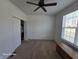 Bright bedroom with neutral carpet, closet, and a window for natural light at 720 Erin Dr, Avon, IN 46123