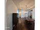 Dining room with tray ceiling and chandelier, plus a dark wood table and decor piece for elegant meal enjoyment at 720 Erin Dr, Avon, IN 46123