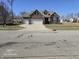 Charming two-story brick home featuring a two-car garage and well-maintained landscaping at 720 Erin Dr, Avon, IN 46123