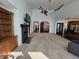 Large living space with a fireplace, open layout, and views into the kitchen making it an ideal gathering place at 720 Erin Dr, Avon, IN 46123