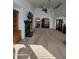 Expansive living area with a fireplace, built-in shelving, and an open floor plan connecting to the kitchen and dining areas at 720 Erin Dr, Avon, IN 46123