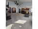 Spacious living area with modern ceiling fans and open layout connecting to the kitchen for seamless entertaining at 720 Erin Dr, Avon, IN 46123