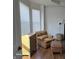 Comfortable living room with a decorative chair, ottoman and large windows offering natural light and a relaxing atmosphere at 720 Erin Dr, Avon, IN 46123