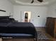 Main bedroom features tray ceilings, a comfortable bed, and an open entryway to enhance spaciousness and design at 720 Erin Dr, Avon, IN 46123