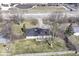 Aerial view of a property with nearby cross street and mature trees, showcasing the surrounding area at 7401 E 56Th St, Indianapolis, IN 46226