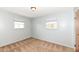 Neutral-toned bedroom has plush carpet and dual windows that welcome in plenty of sunlight at 7401 E 56Th St, Indianapolis, IN 46226
