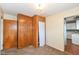Bedroom featuring a closet with a hanging curtain to maximize storage at 7401 E 56Th St, Indianapolis, IN 46226