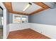 Bright dining room with wainscoting and wood trim, offering ample natural light at 7401 E 56Th St, Indianapolis, IN 46226