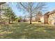 Expansive backyard featuring mature trees and a well-maintained lawn for outdoor activities at 8331 Lookout Ct, Indianapolis, IN 46217