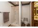 Bathroom featuring a tiled stand up shower, toilet, and a traditional vanity at 8331 Lookout Ct, Indianapolis, IN 46217