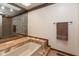 Bathroom showcasing a tiled tub surround, tile floors, and a large wall mirror at 8331 Lookout Ct, Indianapolis, IN 46217