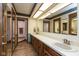 Bathroom featuring a double sink vanity with an adjacent open doorway to a shower and toilet at 8331 Lookout Ct, Indianapolis, IN 46217