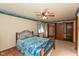 Bedroom with a ceiling fan and a comfortable bed, with an adjacent walk in closet at 8331 Lookout Ct, Indianapolis, IN 46217