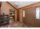 Home entryway with tiled floors and view into the kitchen at 8331 Lookout Ct, Indianapolis, IN 46217