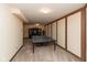 Spacious finished basement with ping pong table and paneled walls, great for recreation and entertaining at 8331 Lookout Ct, Indianapolis, IN 46217