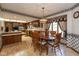 Eat-in kitchen with wooden cabinets, laminate floors, and an island counter at 8331 Lookout Ct, Indianapolis, IN 46217