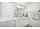 Elegant bathroom with double sinks, marble countertop, decorative floor tiles, and a walk-in shower at 10479 Dusty Rose Dr, Zionsville, IN 46077