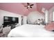 Bedroom featuring a pink ceiling, neutral walls, carpet, and a ceiling fan at 10479 Dusty Rose Dr, Zionsville, IN 46077