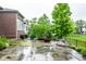 Spacious stone patio with fire pit provides an elegant outdoor living space at 12167 Ams Run, Carmel, IN 46032