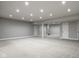 Expansive basement featuring neutral carpet, recessed lighting, and support beams at 12167 Ams Run, Carmel, IN 46032