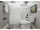 Cozy bathroom with a shower-tub combination, white tile, and decorative shower curtain at 12167 Ams Run, Carmel, IN 46032