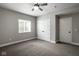 Bedroom with light gray walls, neutral carpeting, ceiling fan, and a closet at 12167 Ams Run, Carmel, IN 46032
