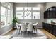 Elegant dining room with modern lighting and large windows for natural light at 12167 Ams Run, Carmel, IN 46032