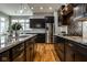 Contemporary kitchen with stainless steel appliances and sleek, dark cabinetry at 12167 Ams Run, Carmel, IN 46032