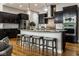 Modern kitchen with a central island, pendant lighting, and bar stool seating at 12167 Ams Run, Carmel, IN 46032