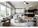 Spacious living room with an open floor plan connecting to the kitchen, complete with stylish furnishings at 12167 Ams Run, Carmel, IN 46032