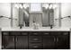 Main bathroom featuring double vanity with dark cabinets, and stylish décor at 12167 Ams Run, Carmel, IN 46032