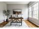 Serene home office featuring a stylish desk, comfortable chair, and ample natural light from large windows at 12167 Ams Run, Carmel, IN 46032