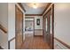 Inviting entryway with wood flooring, decorative trim, and a glimpse into the living spaces at 12715 Charing Cross Rd, Carmel, IN 46033