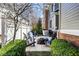 Backyard features a stone fire pit, Adirondack chairs and lush landscaping at 13018 Deerstyne Green St, Carmel, IN 46032