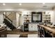 Bar in lower level featuring mini-fridge, shelving and sleek design at 13018 Deerstyne Green St, Carmel, IN 46032