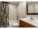 Bathroom with tub and shower and colorful shower curtain at 13018 Deerstyne Green St, Carmel, IN 46032