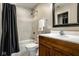 Bathroom featuring a tub shower with shower curtain, and wood vanity at 13018 Deerstyne Green St, Carmel, IN 46032