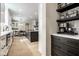 Modern kitchen with stainless steel appliances, a large island, and open layout for easy entertaining at 13018 Deerstyne Green St, Carmel, IN 46032