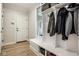 Bright mudroom with built-in storage, bench seating, and convenient access to the exterior at 13018 Deerstyne Green St, Carmel, IN 46032