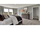 A bright bedroom with plush carpeting features a cozy bed, dresser and large window with a view at 16906 Sandhurst Pl, Westfield, IN 46074