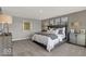 The stylish bedroom is adorned with modern decor and soothing neutral color palette creating a relaxing retreat at 16906 Sandhurst Pl, Westfield, IN 46074