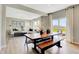 Bright dining area showcases a modern table with bench seating and easy access to the outdoor patio at 16959 Sandhurst Pl, Westfield, IN 46074