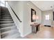 Inviting entryway with stairs, light wood flooring, and a view of the front door at 16959 Sandhurst Pl, Westfield, IN 46074