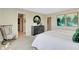 Bright main bedroom featuring bedside tables and art, with views into the bathroom at 16959 Sandhurst Pl, Westfield, IN 46074